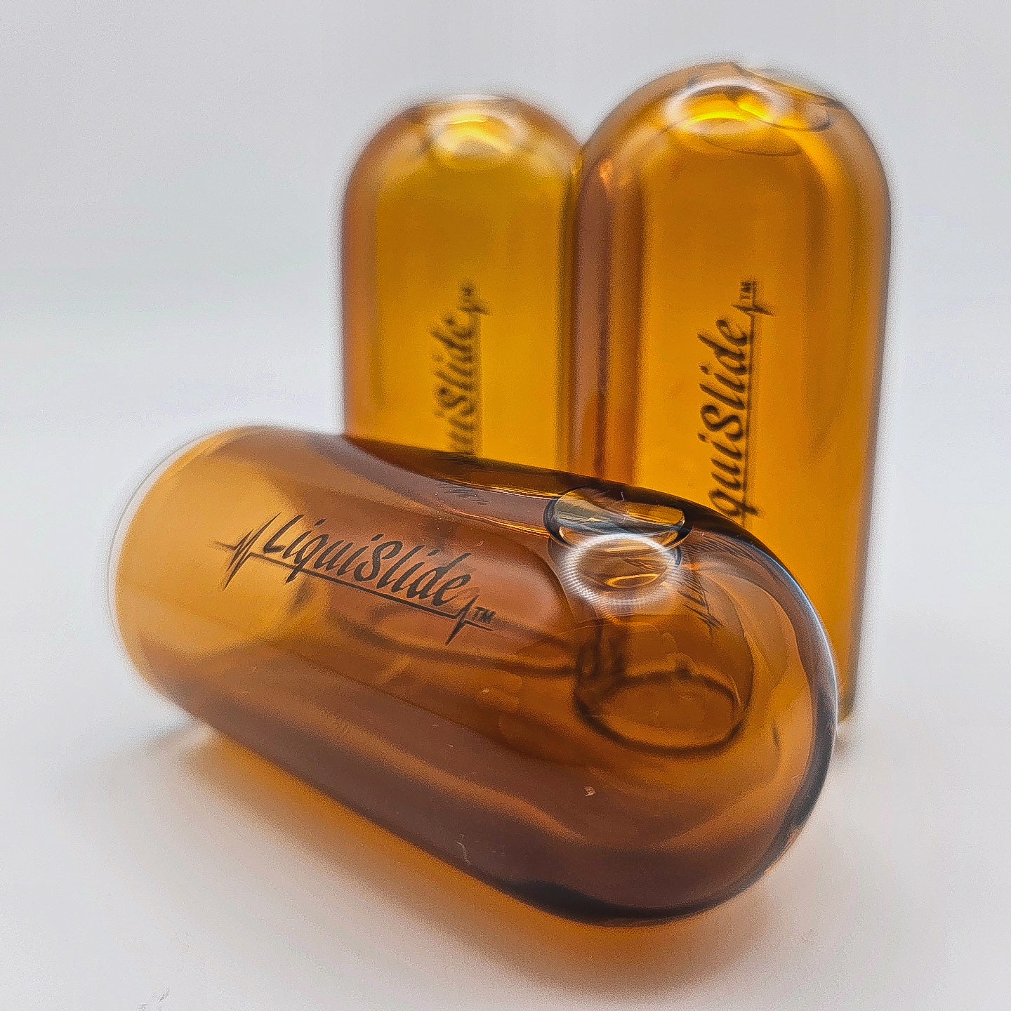 The LiquiSlide - Knuckle Sized Glass Guitar Slide- Burnt Orange - Liquislide