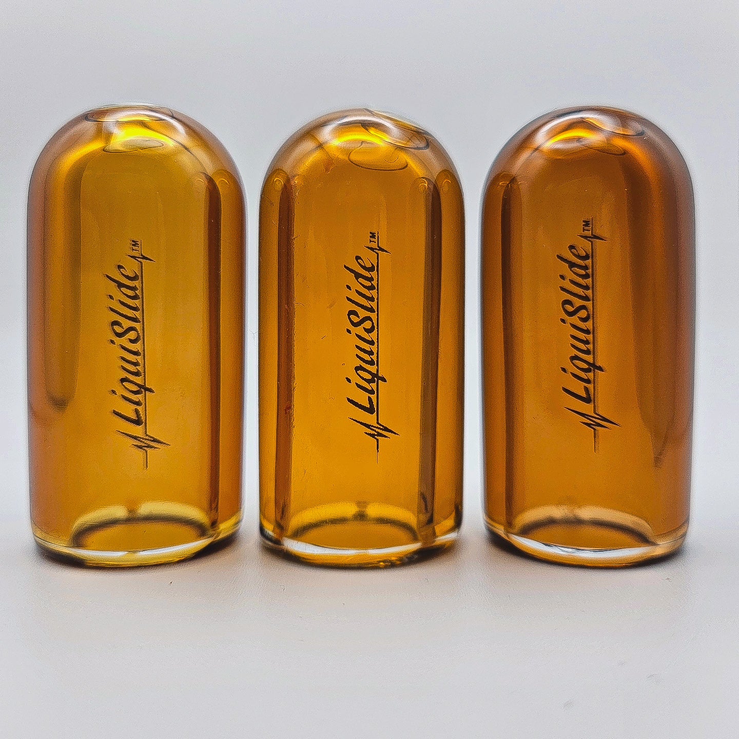 The LiquiSlide - Knuckle Sized Glass Guitar Slide- Burnt Orange - Liquislide