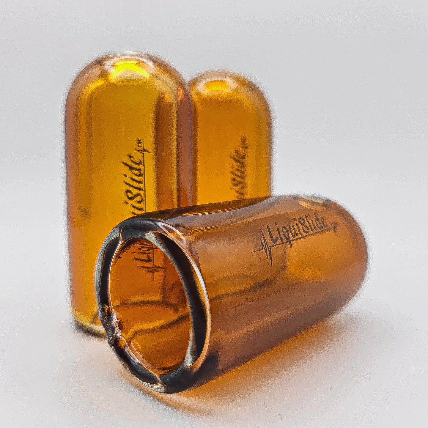 The LiquiSlide - Knuckle Sized Glass Guitar Slide-  Burnt Orange - Liquislide